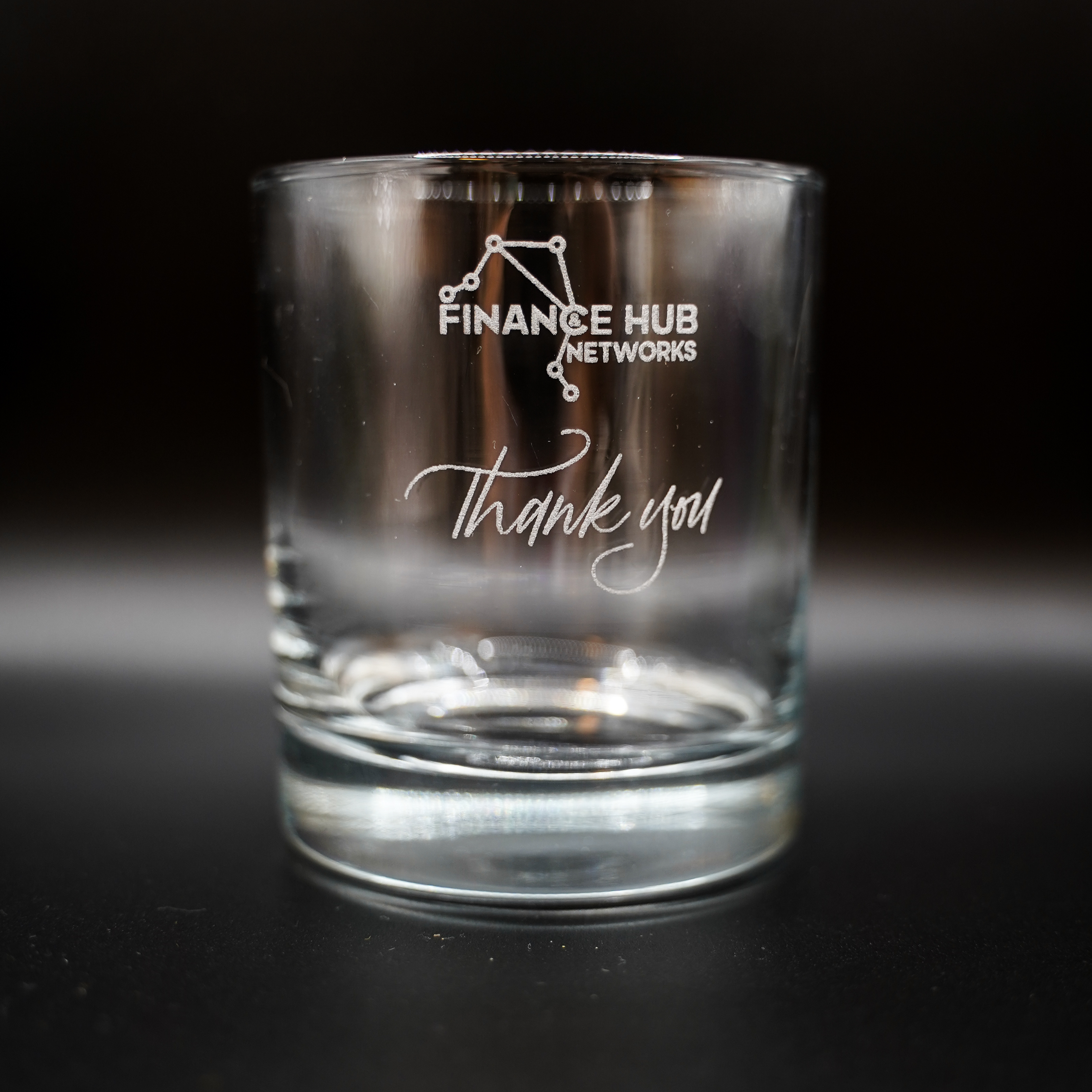 Corporate-branded whisky tumbler engraved with a 'Thank you' message by Kimlligraphy.